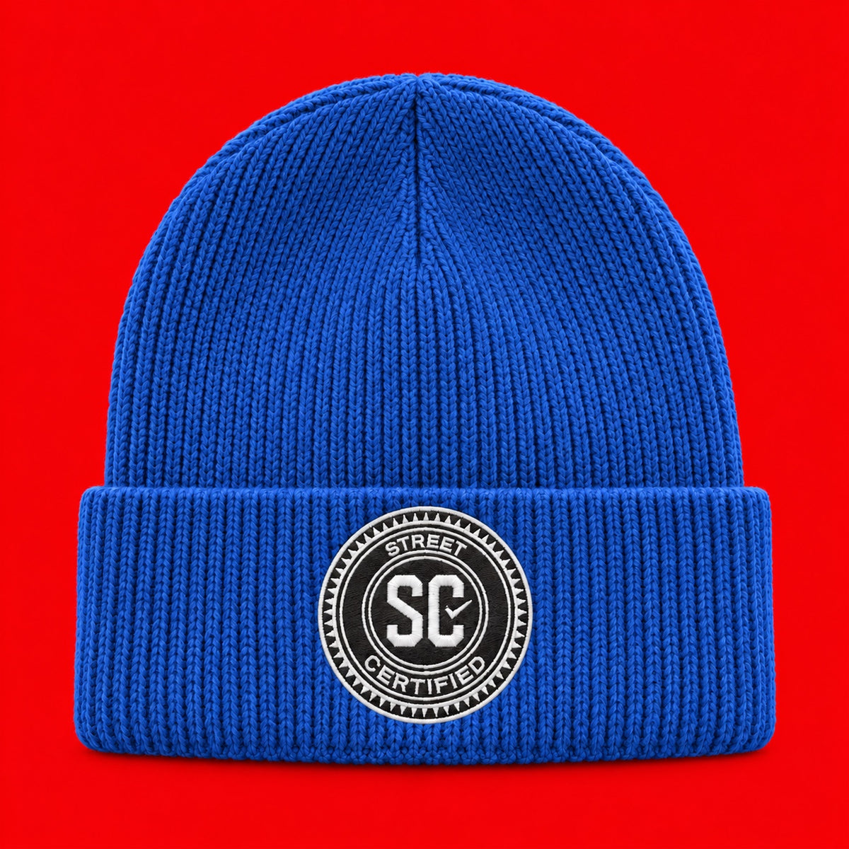 Street Certified Signature Cuffed Beanie in Royal Blue on a red background