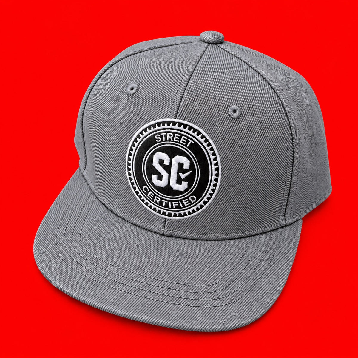 Street Certified Signature Logo Snapback in Gray on a red background