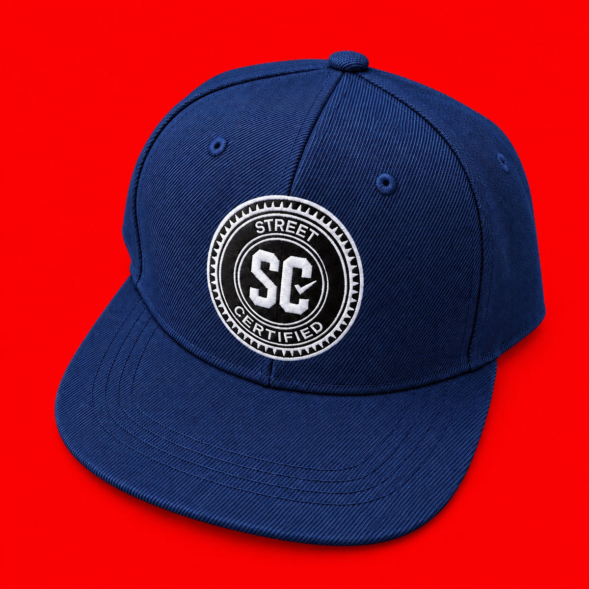 Street Certified Signature Logo Snapback in Navy Blue on a red background