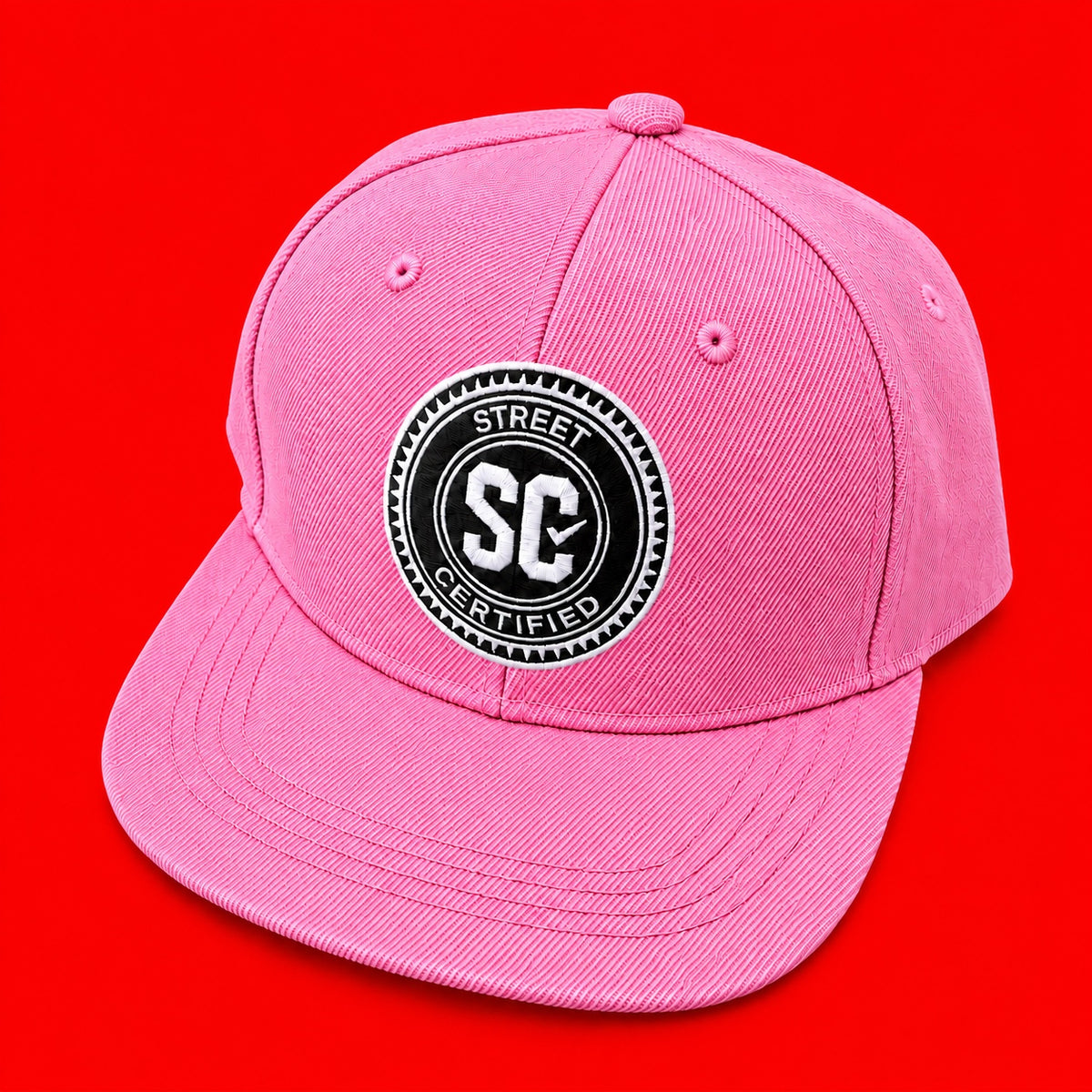 Street Certified Signature Logo Snapback in Pink on a red background