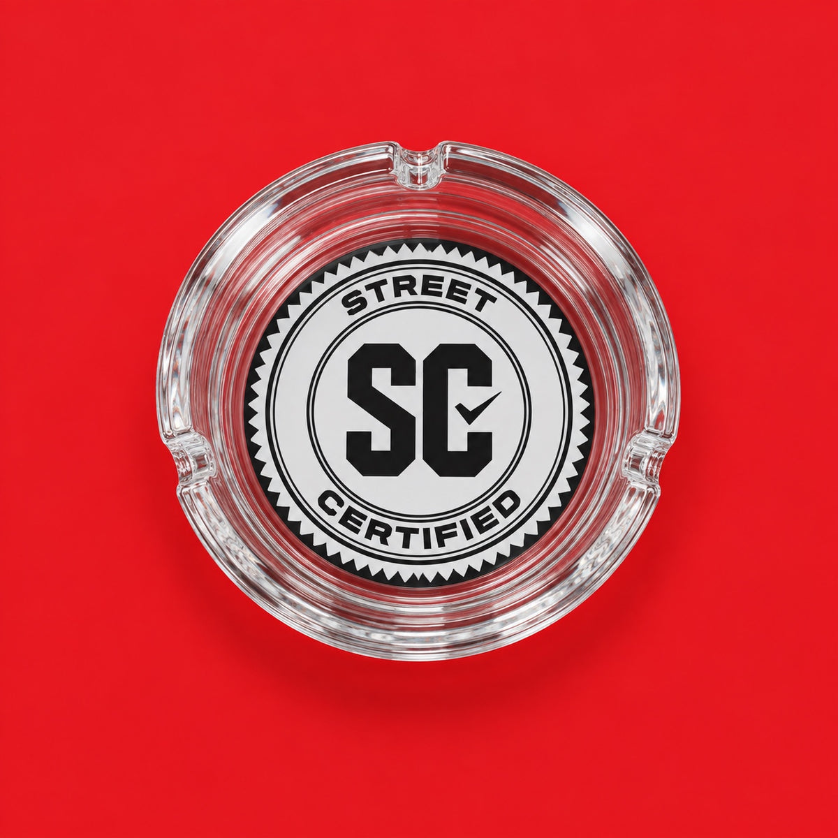 Street Certified Signature Logo Glass Ashtray in Clear on a red background