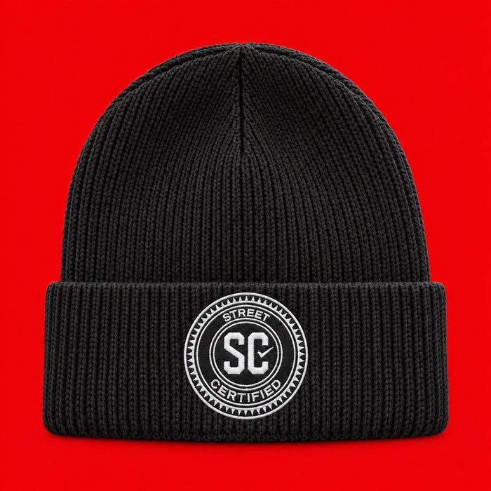 Street Certified Signature Cuffed Beanie in Black on a red background