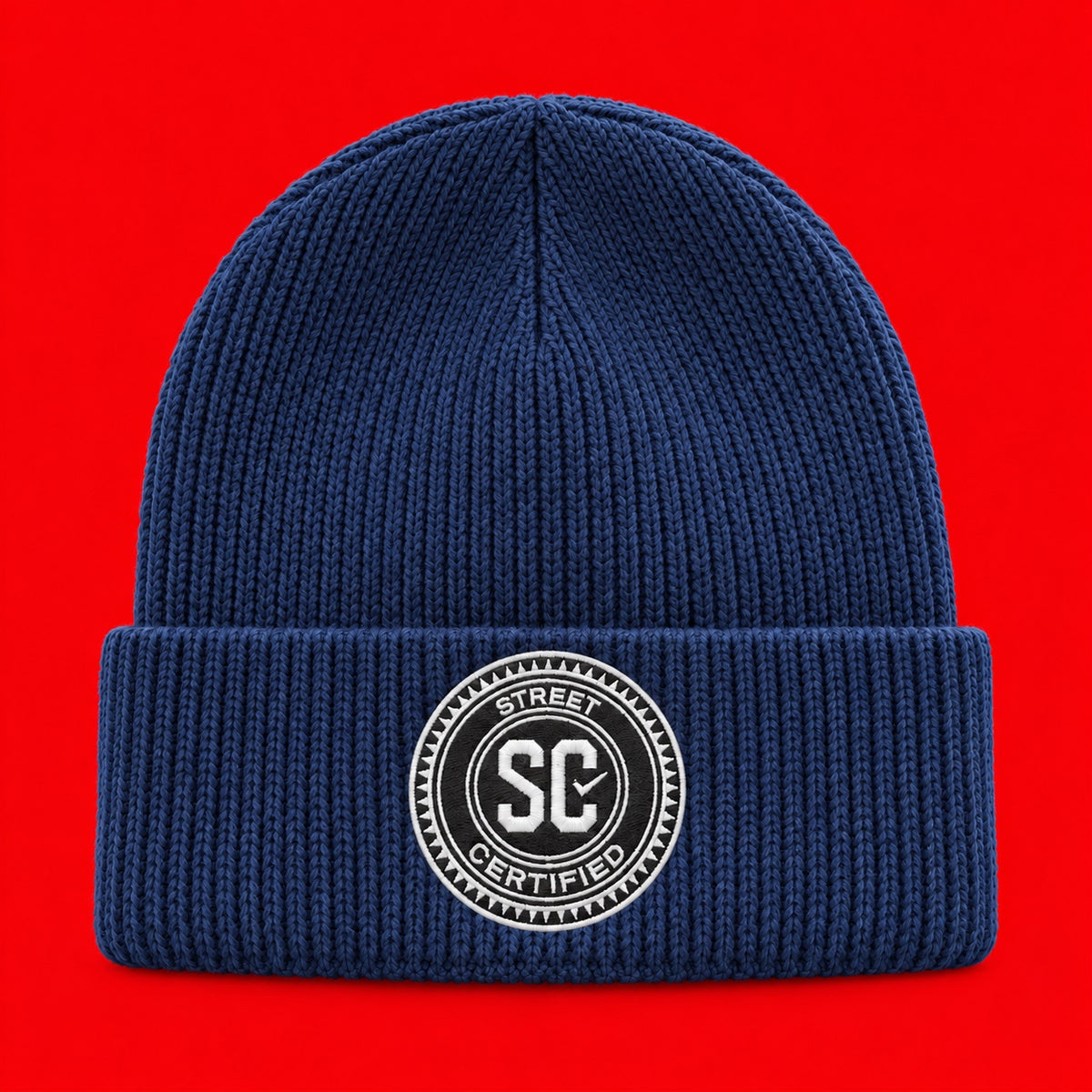 Street Certified Signature Cuffed Beanie in Navy Blue on a red background