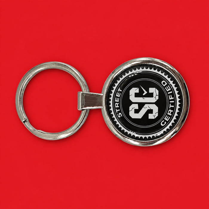 Street Certified Signature Logo Keychain in Black on a red background