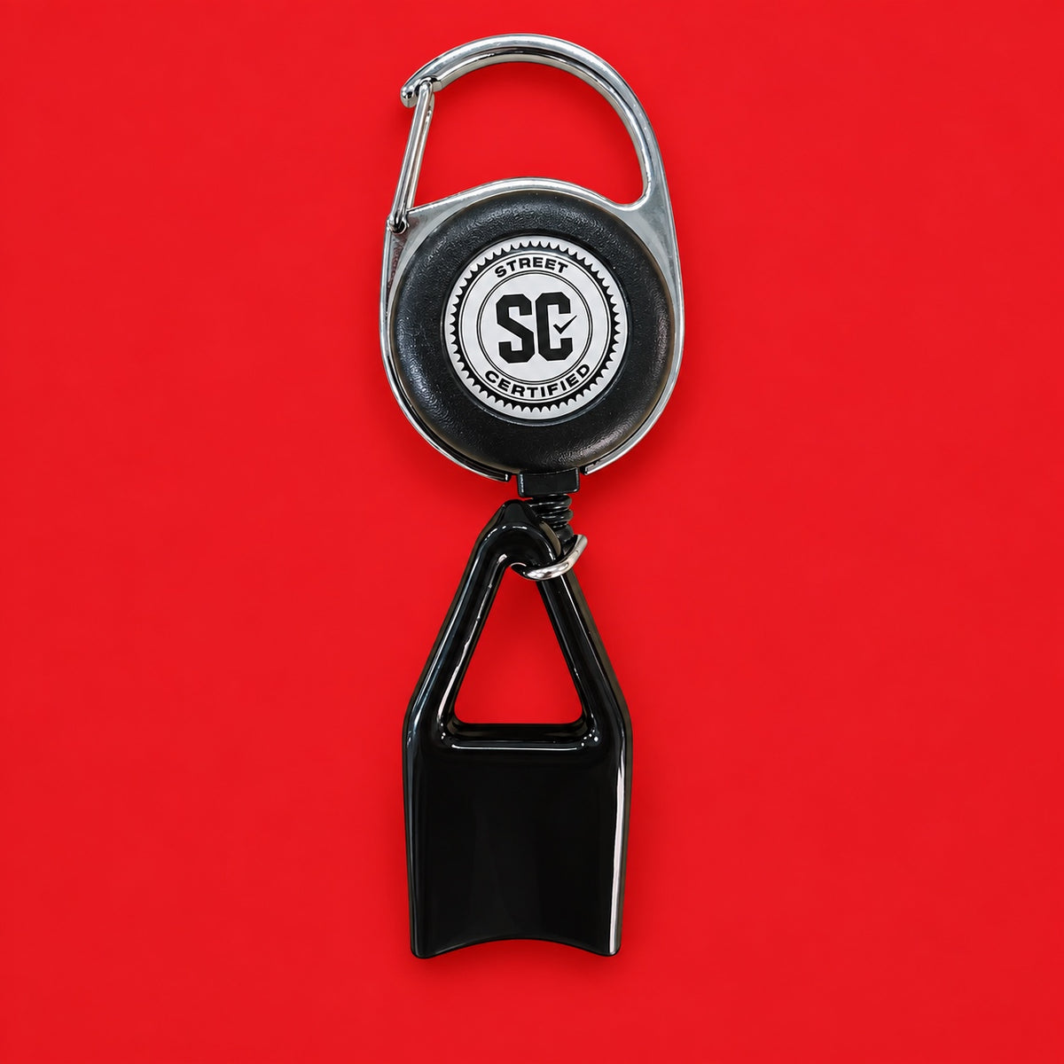 Street Certified Signature Retractable Clip in Black on a red background