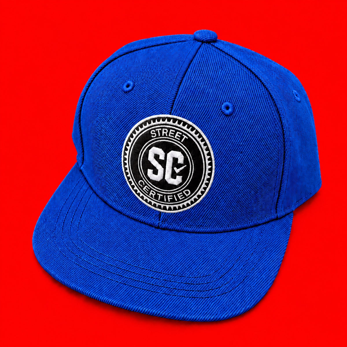 Street Certified Signature Logo Snapback in Royal Blue on a red background